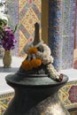 Phuang Malai offerings placed on metal urn