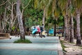 Empty, calm sandy crescent Patong Beach with turquoise blue clear water and cirrus cloudy sky