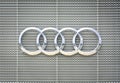 Phuket, Thailand -  August 8, 2019 : close up Audi emblem on metal background in front of Audi`s auto dealerships building Royalty Free Stock Photo