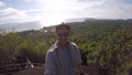 Phuket, Thailand- 20 DEC 2016: Happy young bearded man making GoPro selfie at the poplular viewpoint at Koh Phangan, Thailand.