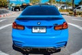 PHUKET, THAILAND- DECEMBER 25, 2023: Beautiful bright blue BMW M3 series in the parking lot. Royalty Free Stock Photo