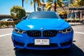 PHUKET, THAILAND- DECEMBER 25, 2023: Beautiful bright blue BMW M3 series in the parking lot. Royalty Free Stock Photo