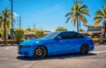 PHUKET, THAILAND- DECEMBER 25, 2023: Beautiful bright blue BMW M3 series in the parking lot. Royalty Free Stock Photo