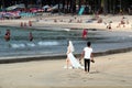 Phuket, Thailand - December 4, 2019: A wedding ceremony at Kamala Beach, Phuket. Beautiful bride at the seaside. Photographer at