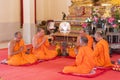 Phuket, Thailand, 04/19/2019 - Group of buddhist monks praying together at the Chalong Temple