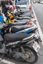 row of parked motorbikes on Talang's central street