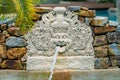 Phuket, Thailand - May, 08, 2022 : Balinese style sculpture fountain by the pool of Thavorn Beach Village Resort & Spa at Phuket, Royalty Free Stock Photo