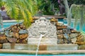 Phuket, Thailand - May, 08, 2022 : Balinese style sculpture fountain by the pool of Thavorn Beach Village Resort & Spa at Phuket, Royalty Free Stock Photo