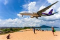 Phuket, Thailand - May 14, 2018 : Landing aircraft above the beach at Phuket Airport. Mai Khao beach, one of the most popular beac