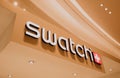 PHUKET, THAILAND - MAY 29, 2022: Swatch brand retail shop logo signboard on the storefront in the shopping mall