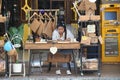 Thai woman making purses out of cork