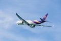 Phuket - Thailand - October 23,2017 : Thai airways airplane ,Boeing 777 is landing at Phuket airport over the Mai Khao beach Royalty Free Stock Photo