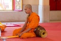 Phuket, Thailand, 04/19/2019 - Single buddhist monk praying at the Chalong Temple