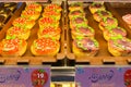 Trays of freshly made donuts