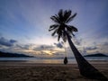 Phuket, Thailand. Tropical beach paradise with beach swing with women sitting. sunset with silhouette women relax on swing under Royalty Free Stock Photo