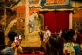 Local guide telling story of temple and mural painting of love story with tourist