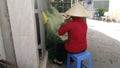 Phuoc Hiep, Vietnam - 04 29 2019: Women are knitting fishing nets.