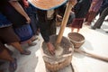 Phutai minority woman pounding rice.