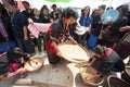 Phutai minority woman winnowing rice.