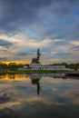 Sunset sky and Buddha statue at PhutthamonthonBuddhist park in Nakhon Pathom Province of Thailand