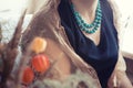 Phyllis flowers and woman in turquoise beads Royalty Free Stock Photo