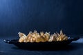 Physalis in a cast-iron plate on a dark background Royalty Free Stock Photo