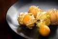 Physalis fruit or capegooseberry on plate. Royalty Free Stock Photo