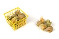 Physalis fruits in and out of a plastic basket on white Royalty Free Stock Photo