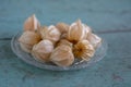 Physalis peruviana ripened orange yellow cape gooseberry goldenberry edible tasty ingredient fruits spread on wooden background Royalty Free Stock Photo