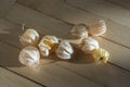 Physalis peruviana ripened orange yellow cape gooseberry goldenberry edible tasty ingredient fruits spread on wooden background Royalty Free Stock Photo