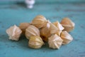 Physalis peruviana ripened orange yellow cape gooseberry goldenberry edible tasty ingredient fruits spread on wooden background Royalty Free Stock Photo