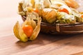 Physalis on a wooden table Royalty Free Stock Photo