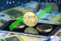 Bitcoin coin on the phone screen on the background of the Euro banknotes. Green arrow of the price growth chart Royalty Free Stock Photo