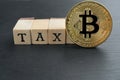 Physical Bitcoin gold coin with tax text