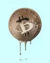 Physical bitcoin melting on a blue background