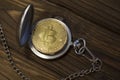 The physical bitcoin and vintage pocket watch shows that time is running out.