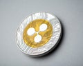 Ripple coin on brushed aluminium background