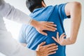 Physical Doctor consulting with patient about Back problems Physical therapy concept