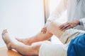 Physical Doctor consulting with patient Knee problems Physical therapy concept Royalty Free Stock Photo