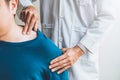 Physical Doctor consulting with patient About Shoulder muscule pain problems Physical therapy diagnosing concept Royalty Free Stock Photo