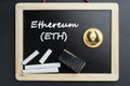 Physical Ethereum gold coin on a blackboard with chalk Royalty Free Stock Photo
