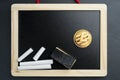 Physical Litecoin gold coin on a blackboard with chalk Royalty Free Stock Photo