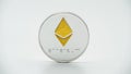 Physical metal silver Ethereum currency on white background. ETH coin