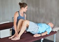 Physical therapist, consultation and elderly man with physiotherapy exercise at rehabilitation center. Medical, help and Royalty Free Stock Photo