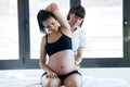 Physical therapist doing stretching to pregnant woman in a spa center Royalty Free Stock Photo