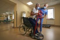 Physical therapist helping stroke patient in rehab center Royalty Free Stock Photo