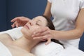 Physical therapist practicing a facial massage Royalty Free Stock Photo