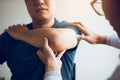 Physical therapists are checking patients elbows at the clinic office room