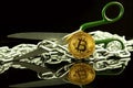 Physical version of Bitcoin, scissors and chain. Conceptual image for Blockchain Technology and hard fork term refers to a situat Royalty Free Stock Photo