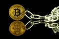 Physical version of Bitcoin virtual money and chain. Conceptual image for Blockchain Technology and hard fork Royalty Free Stock Photo